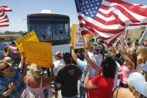 A plan to transport three busloads of Central American families through San Diego for processing at the Murrieta Border Patrol station took an unexpected turn when scores of protesters blocked the buses from entering. 